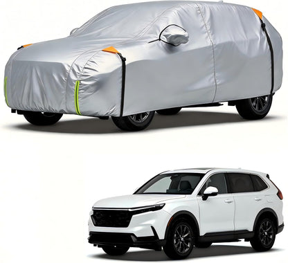 Car covered with a gray car cover and a white SUV on a white background