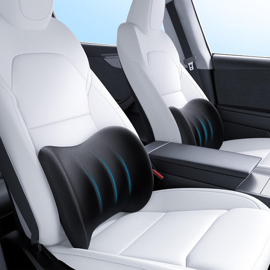 Black car seat massager on a white car seat with a blurred outdoor background