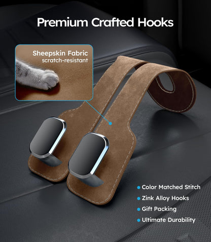 Brown leather car hook with sheepskin fabric and metal hooks on a dark surface