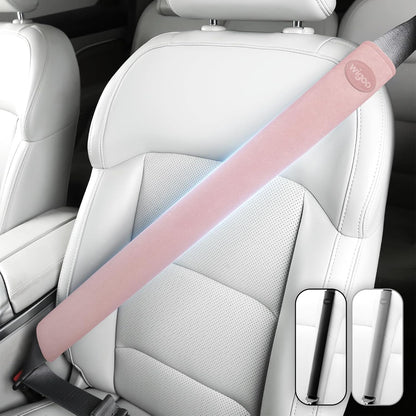 Pink car seat belt cover on a car seat with Wipoo branding.