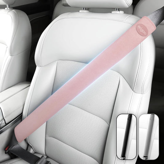 Pink car seat belt cover on a car seat with Wipoo branding.