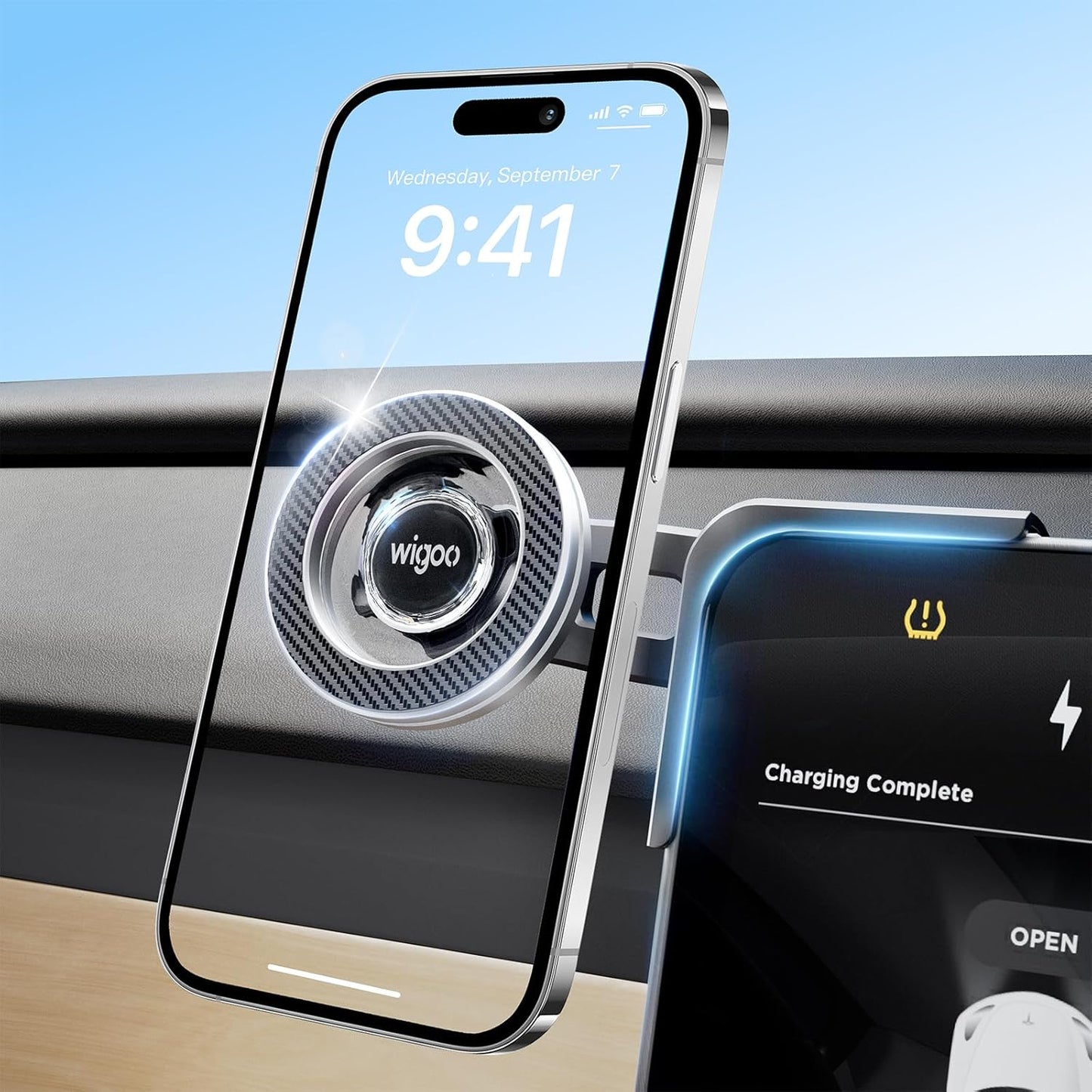 Car phone holder with smartphone displaying 'Wigoo' brand and charging completion message.