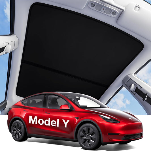 Red Tesla Model Y car with a sunshade on the windshield against a blue sky background