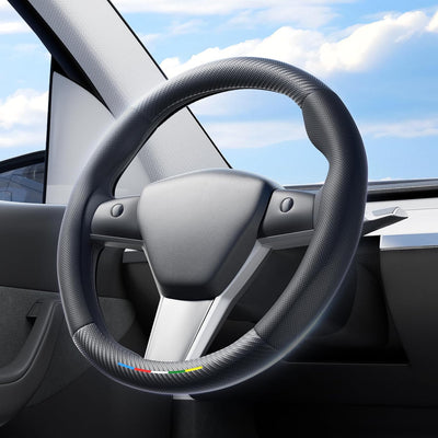 Steering wheel with a brand logo in a car interior