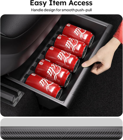 Car storage tray with Coca-Cola cans and a hand pulling out a can.