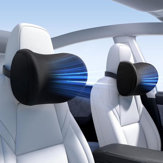 Black car headrest pillows with blue light effect in a car interior.