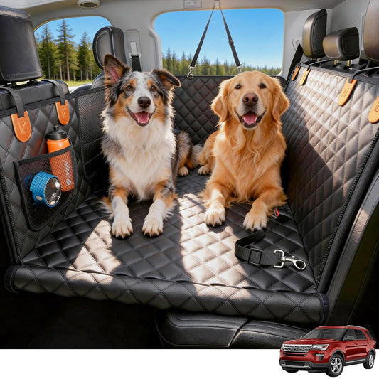 Two dogs sitting on a car bench seat cover with a red SUV in the corner.