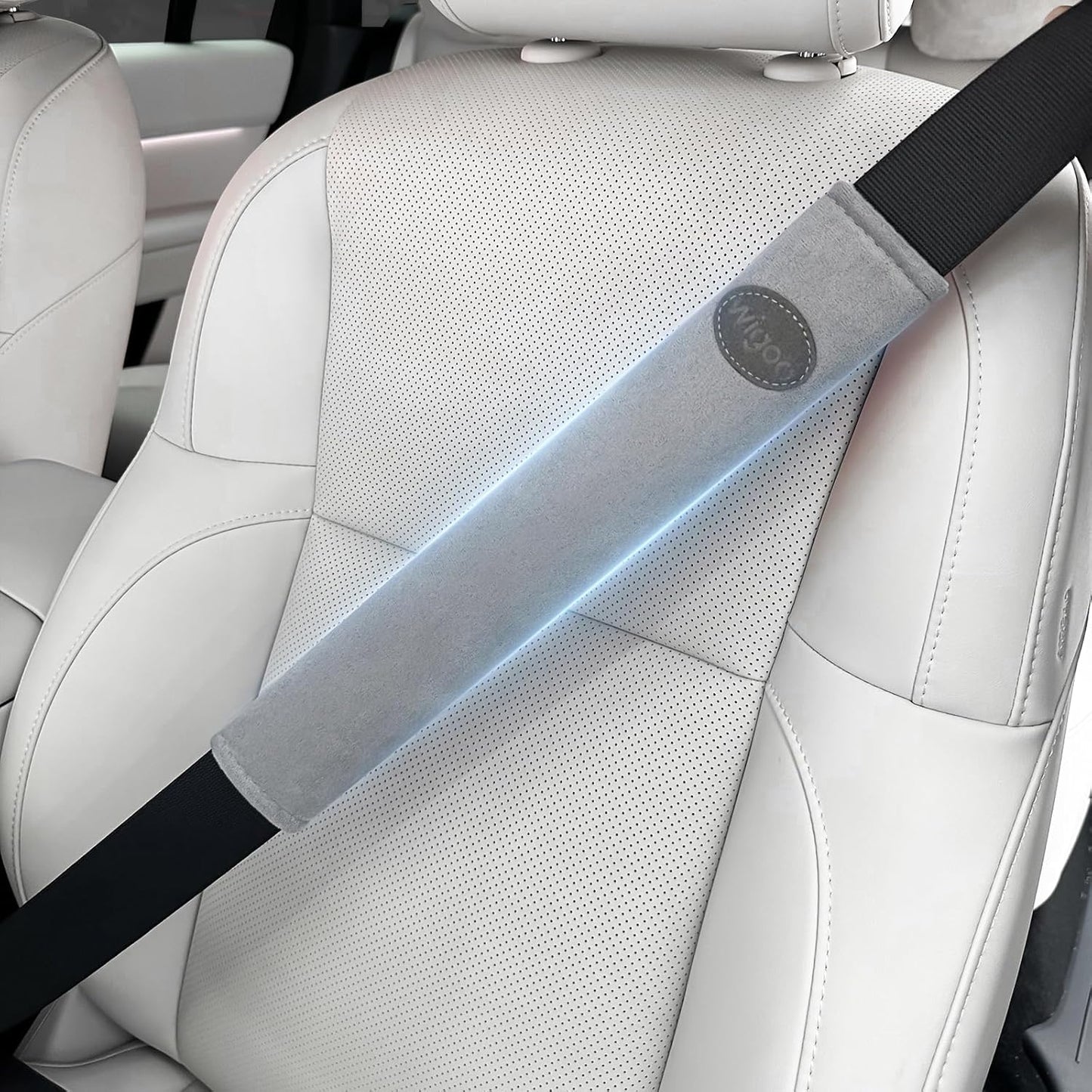 Car seat with a seat belt and a blue light attached to it