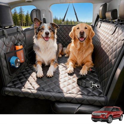 Two dogs sitting on a car seat cover with a red SUV in the corner.